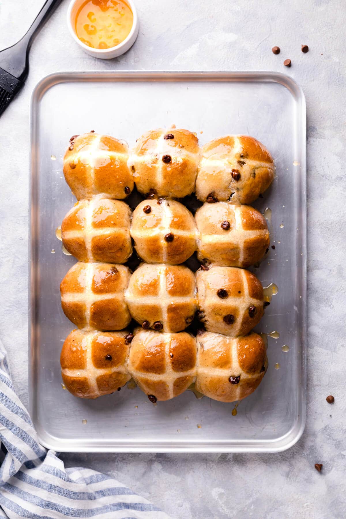top view of baking sheet with hot cross buns