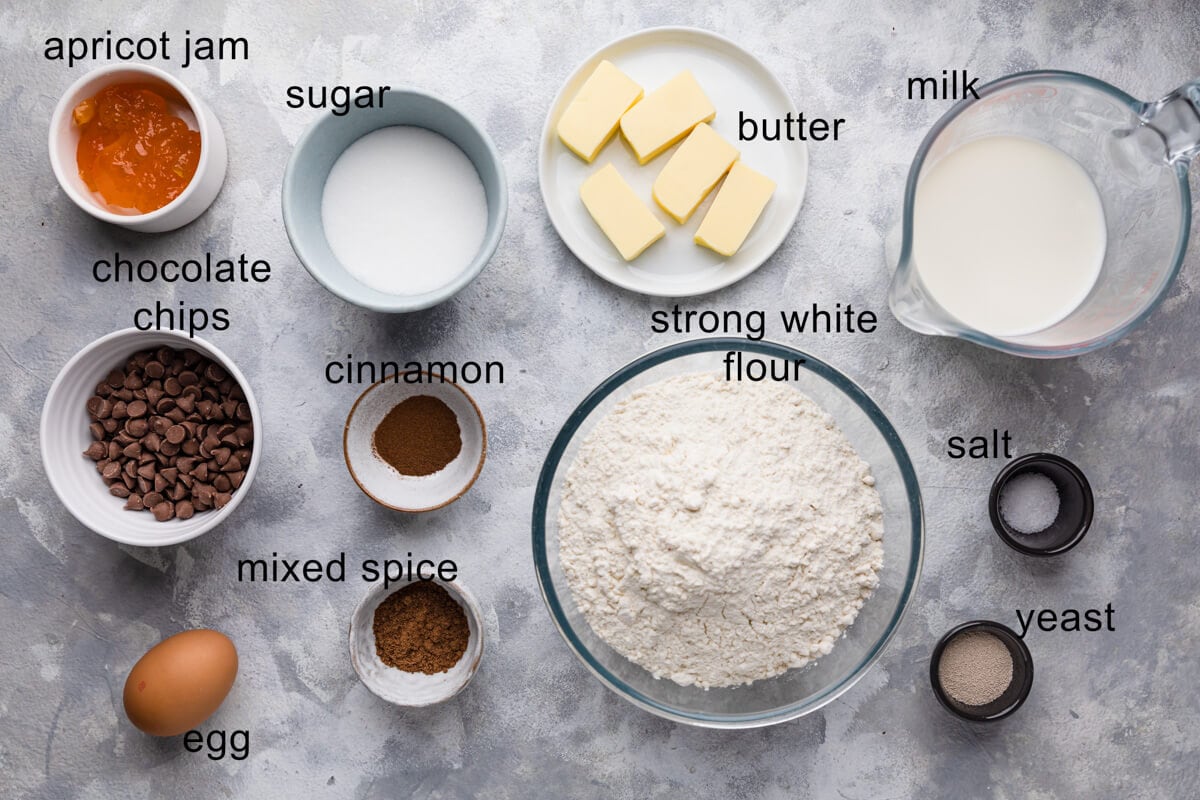 top view of the ingredients for chocolate chip hot cross buns with text labels