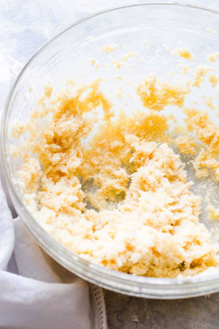 close up of whipped butter and sugar in a bowl