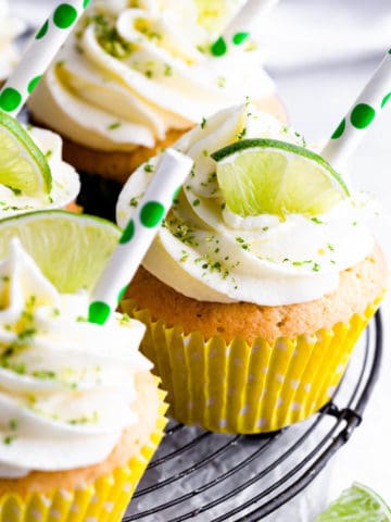 side close up at a gin and tonic cupcake with slice of lime