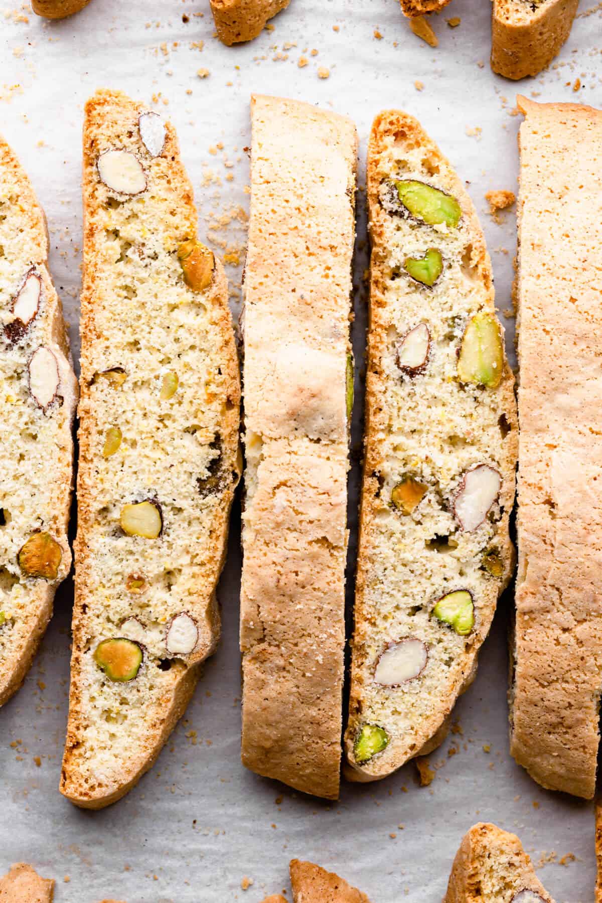 top view close up at few slices of biscotti with pistachios and almonds