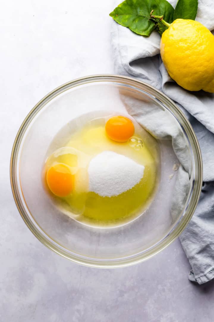 top view of a bowl with eggs and sugar