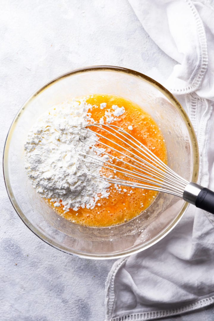 overhead shot of cornflour in a bowl with egg mixture