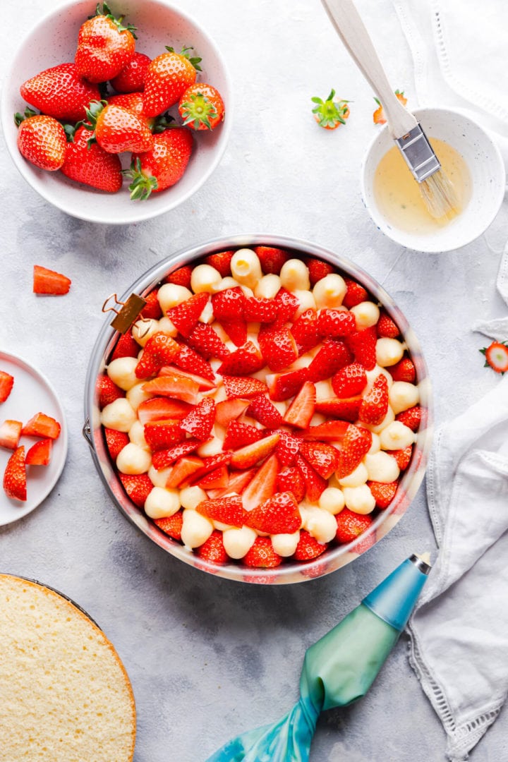 overhead shot of sponge cake topped with fresh strawberries