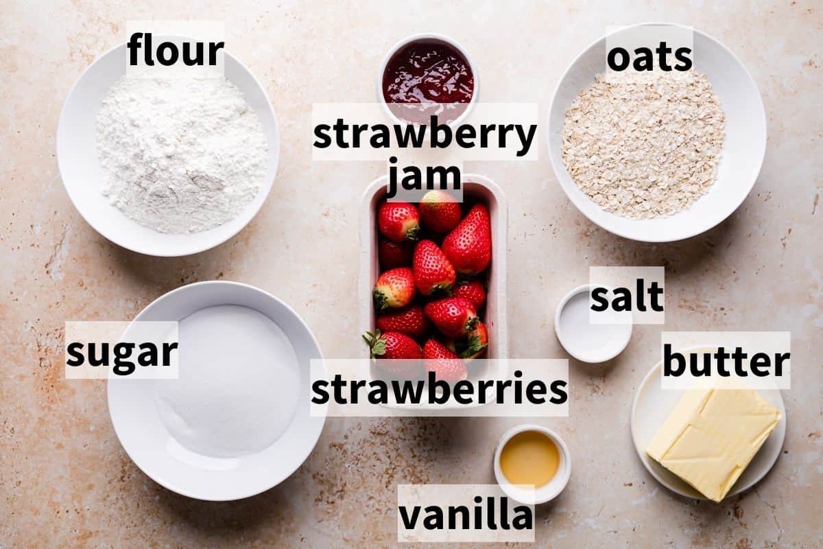 bowls with the ingredients for crumble bars with strawberries and with text labels.