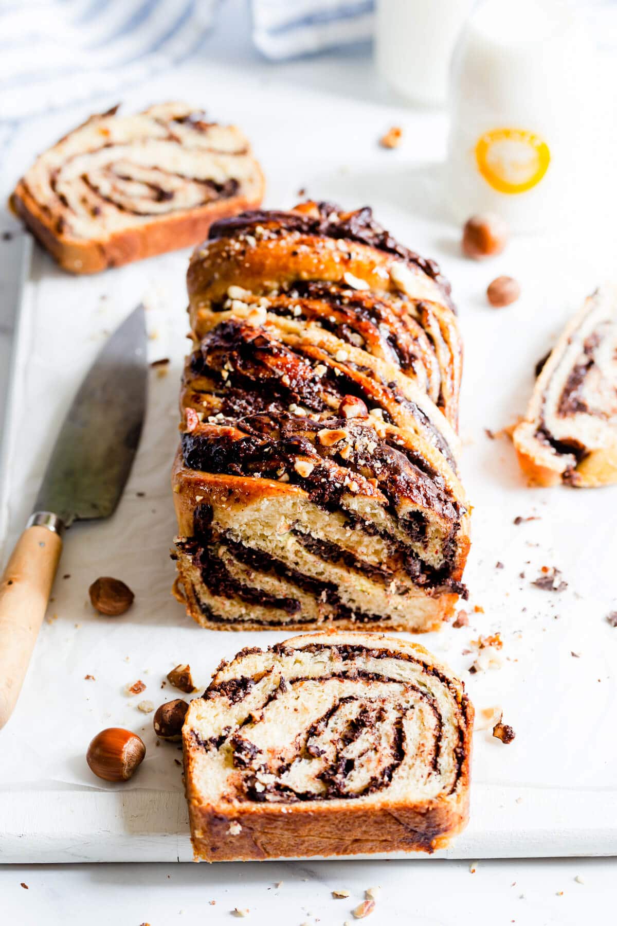 45 degree angle view of loaf of babka with couple of slices cut off