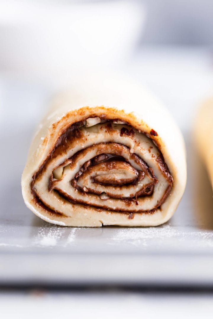 straight ahead super close up of a rolled babka dough with chocolate filling