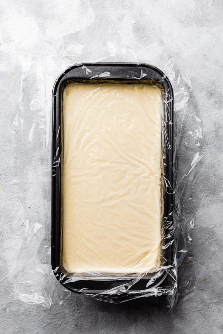 top view of container with ice cream mixture covered with clingfilm