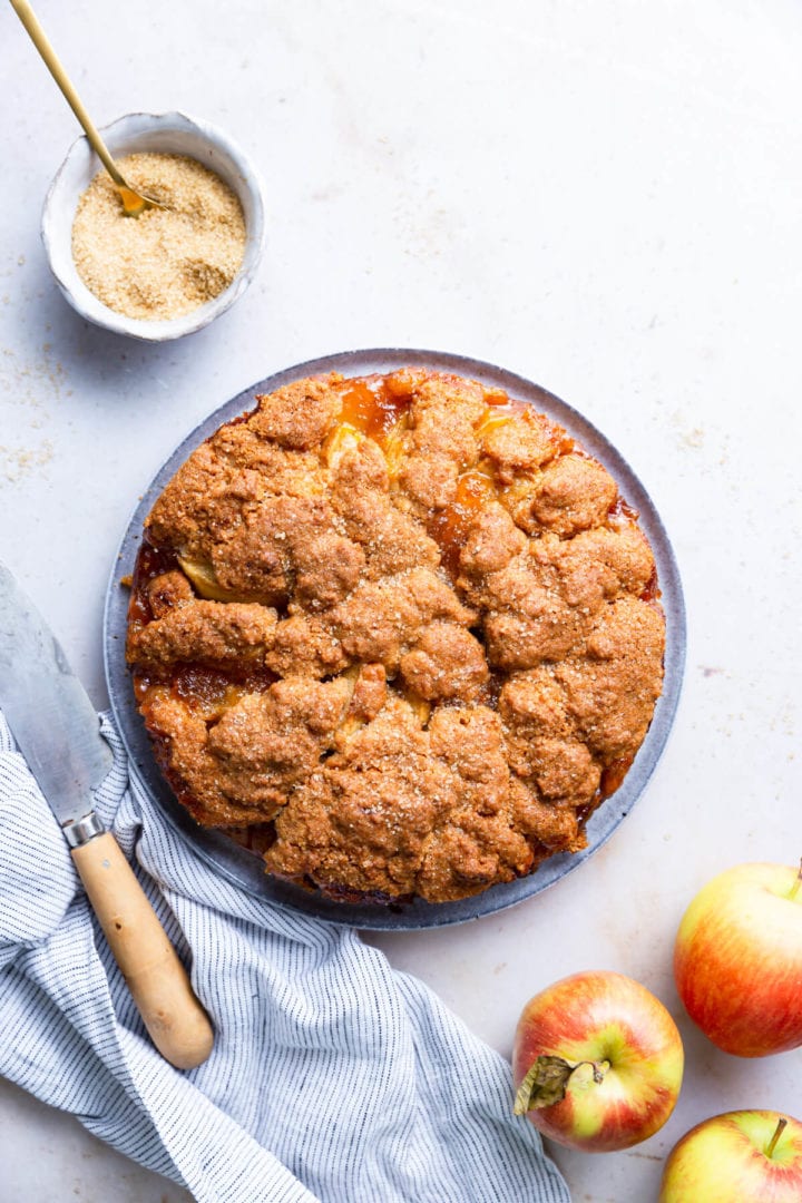 overhead shot of baked easy apple cake sprinkled with sugar on top