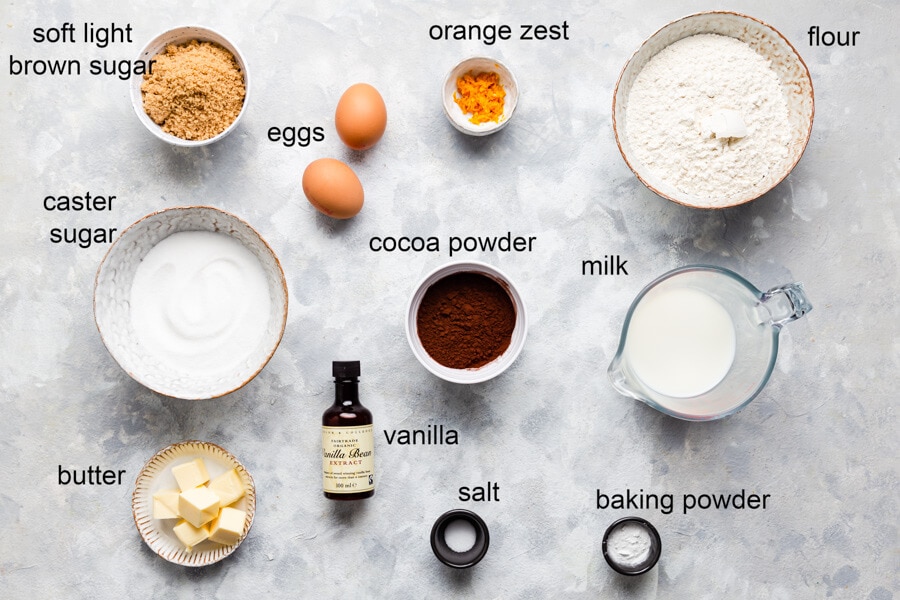 overhead view of the ingredients for chocolate orange cupcakes with labels