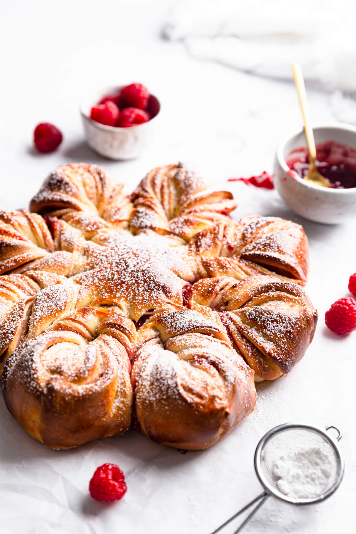 side close up at a festive star bread with raspberries