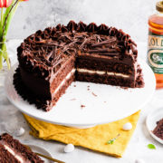 45 degree angle view at a chocolate cake on a cake stand