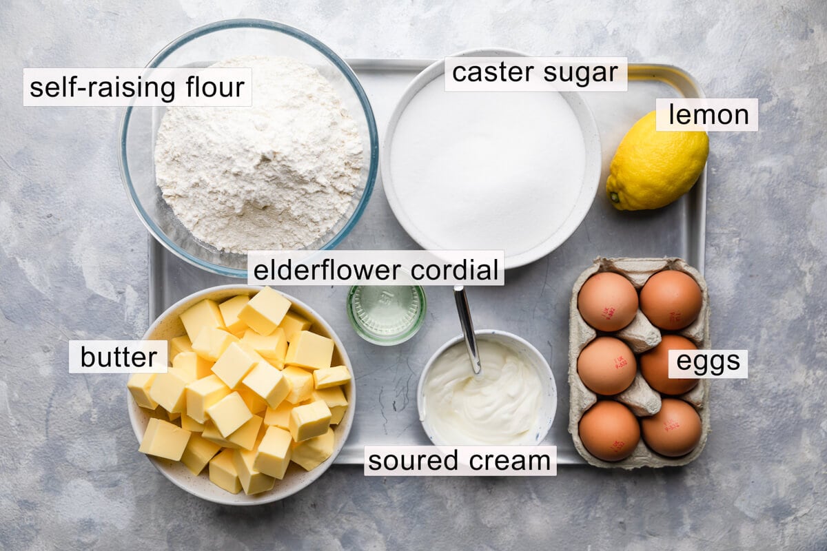 overhead view of the ingredients for the lemon elderflower cake with text labels