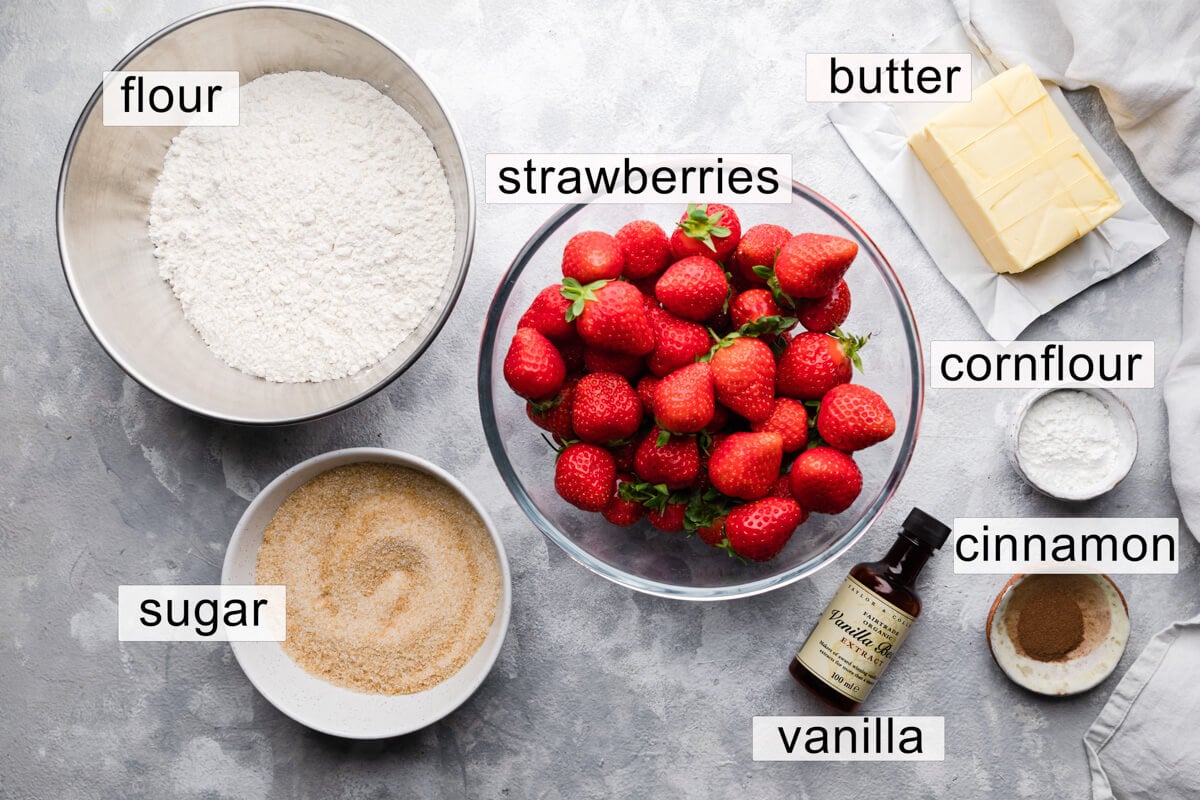 top down photo of the ingredients for strawberry crumble with text labels