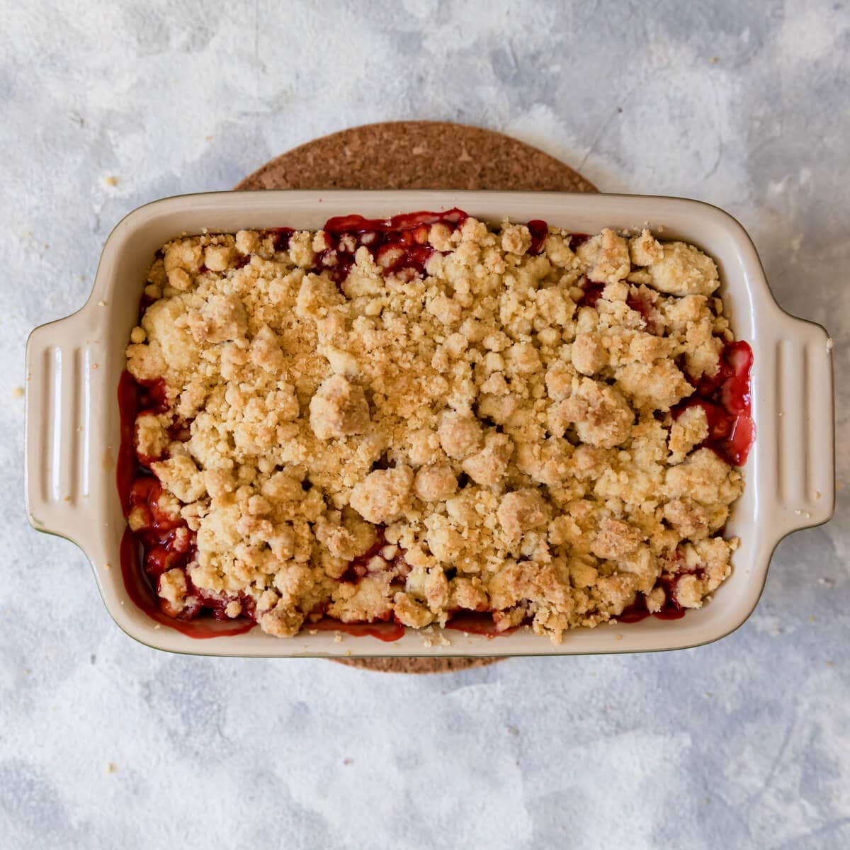 overhead view of a strawberry crumble made with melted butter