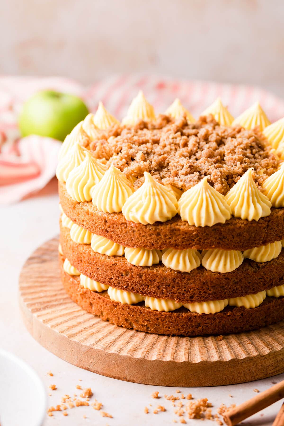 layer cake with apples and German buttercream and crumble topping.