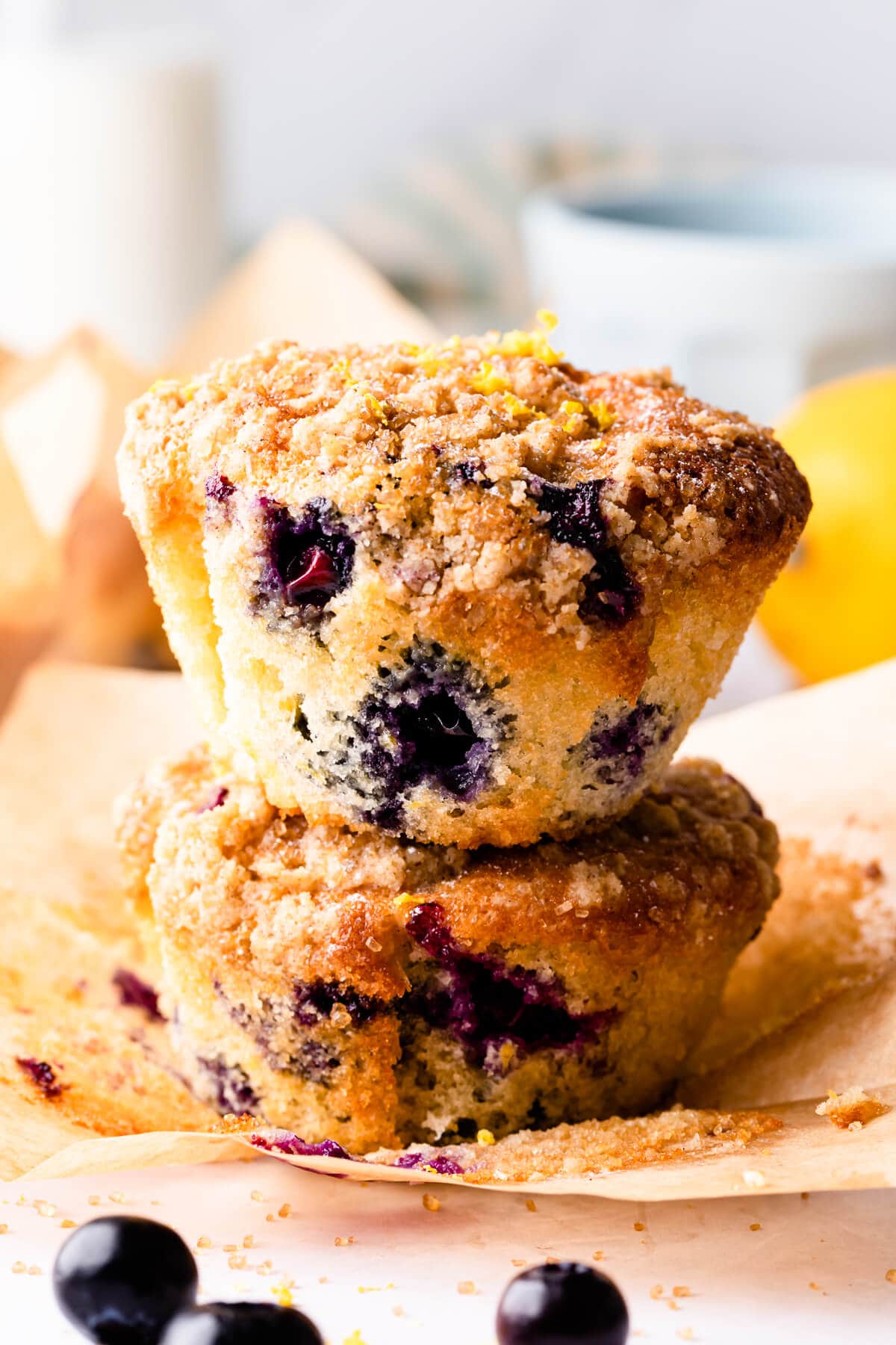one blueberry muffin stacked on top of another one.