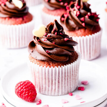 chocolate raspberry cupcake topped with dried raspberries and chocolate heart.