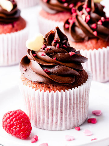 chocolate raspberry cupcake topped with dried raspberries and chocolate heart.