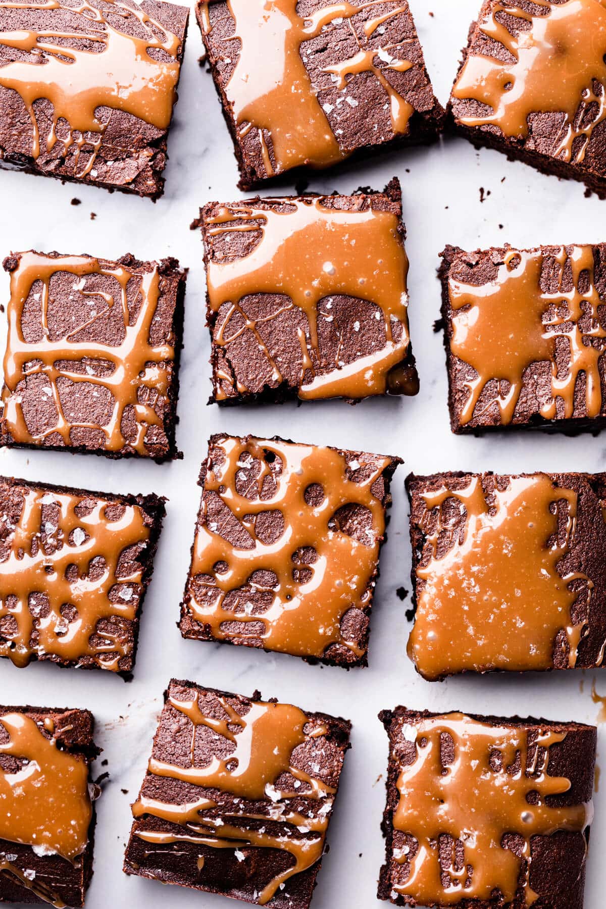 square slices of Guinness brownies topped with caramel and sea salt flakes.