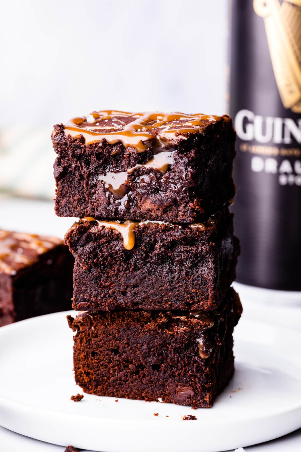stack of 3 Guinness brownies on a small white plate.