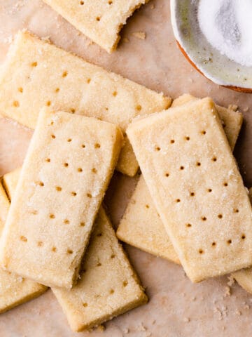 slices of shortbread on top of each other on a brown paper.