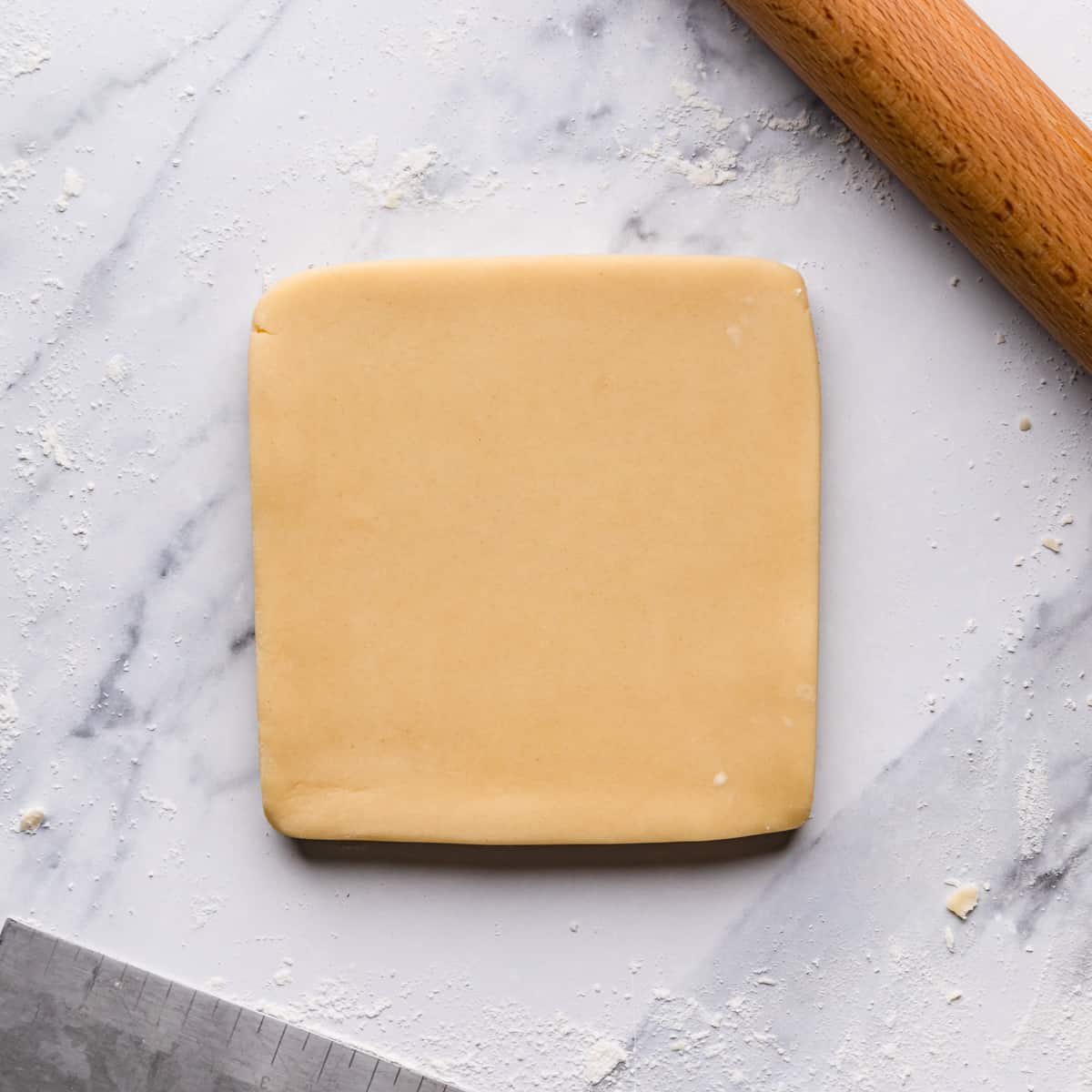 biscuits dough rolled into square on a lightly floured surface.